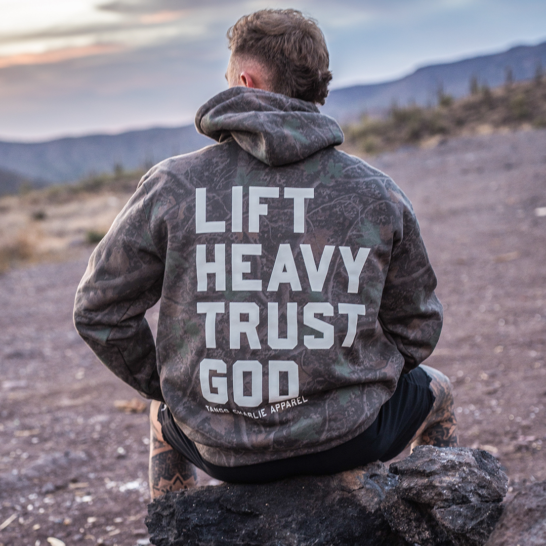 Lift Heavy. Trust God. - Premium Darkwood Camo Hoodie